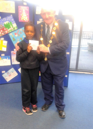 Sasha and Mayor of Limerick recieving award for Christmas Colouring Competition